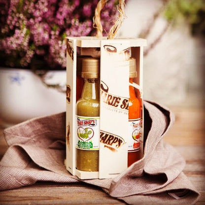 Marie Sharp's Four Little Geschenkset im Holzrahmen auf einem Leinentuch